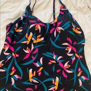 Tankini, size L, but fits smaller. Worn twice, washed once (hung to dry).